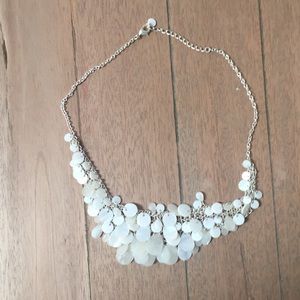 Necklace with white “shell” detail